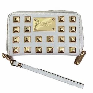 Michael Kors wallet with gold hardware and wrist strap